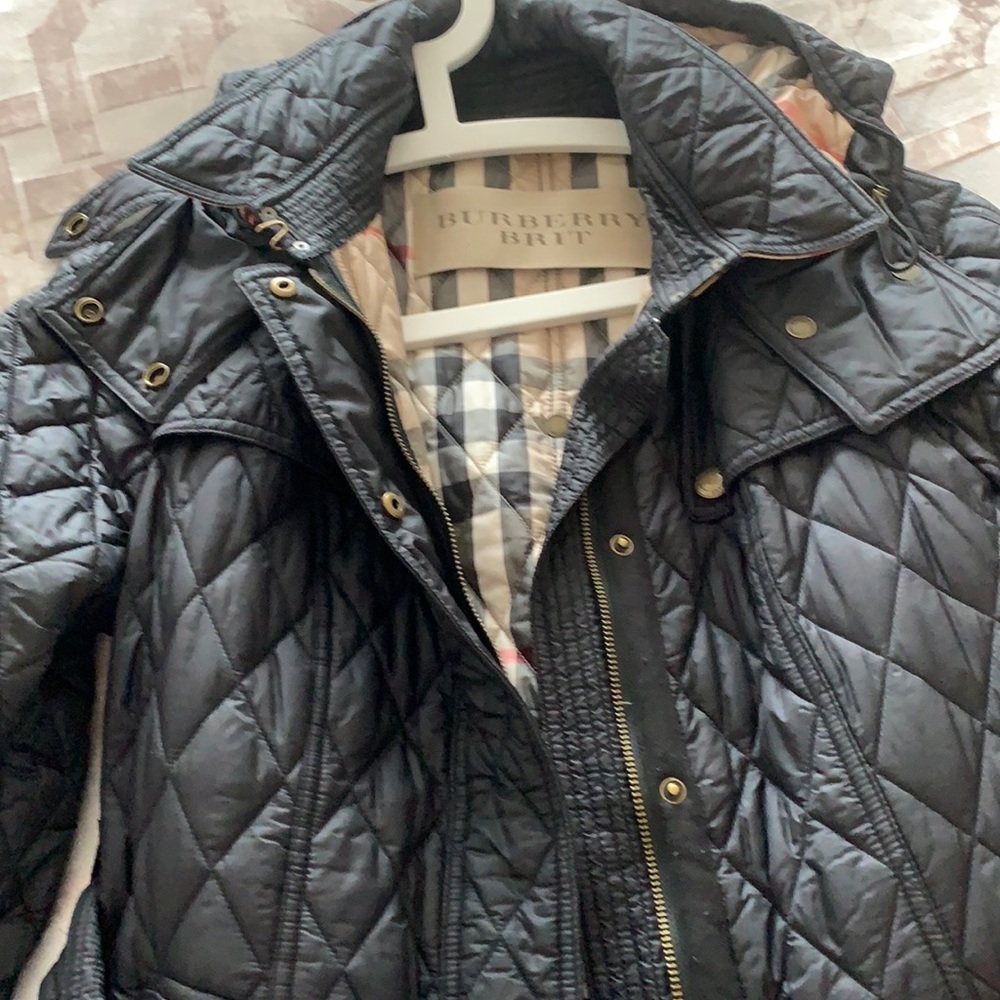 Burberry like new, purchased last year, wore one or two times.